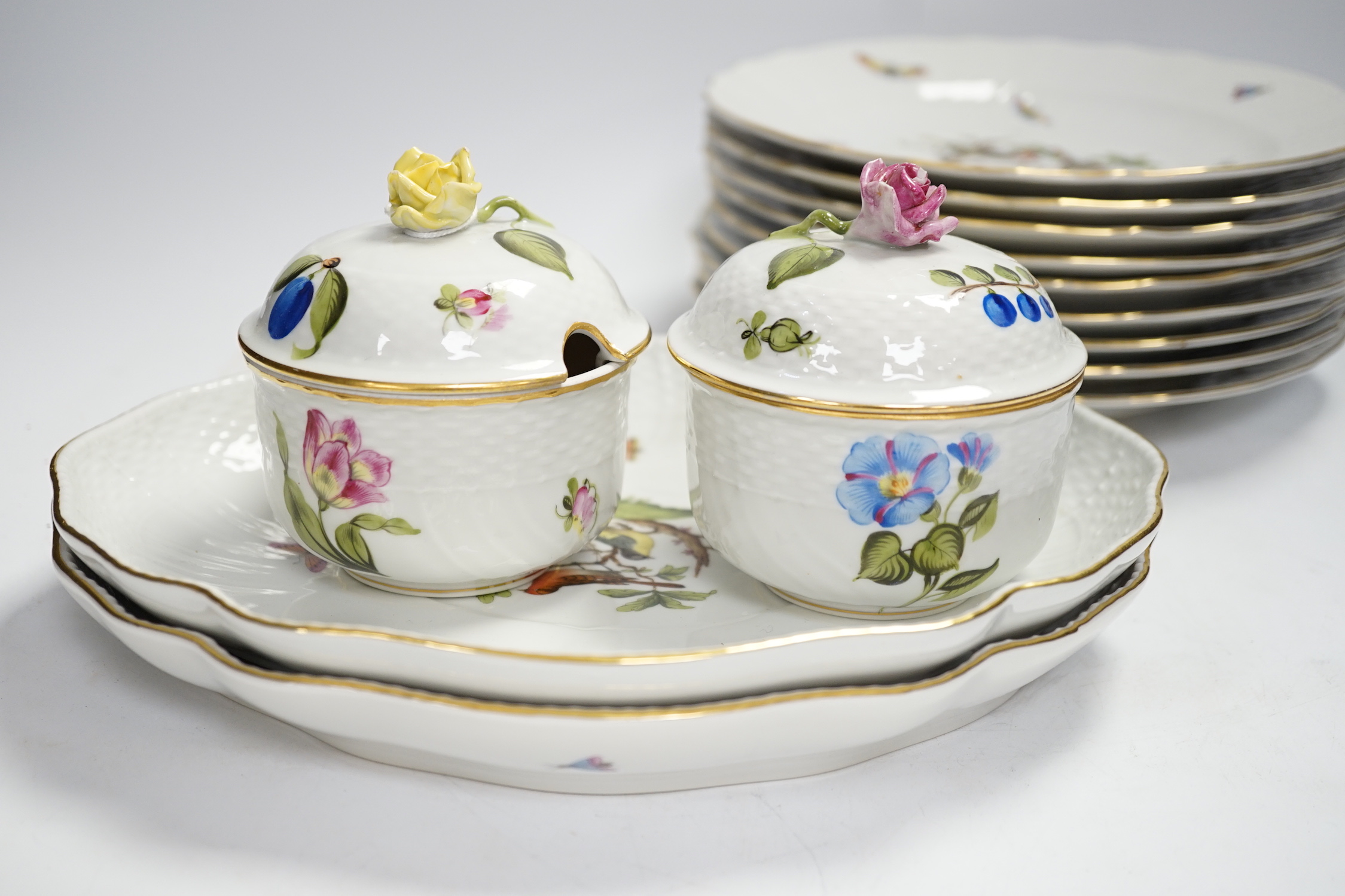 A Herend part dessert service comprising nine plates and two oval dishes together with two bowls, largest 26cm wide